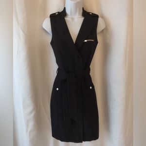 Sleeveless black wrap snap vest dress